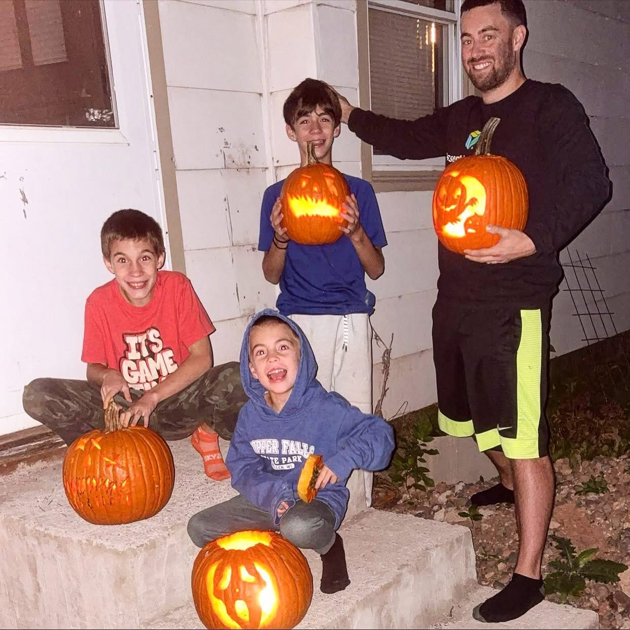 Me and the children Showing off the pumpkins we carved together.